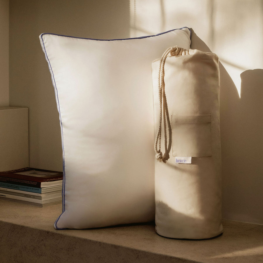 The Henrie pillow along with its sustainable packaging